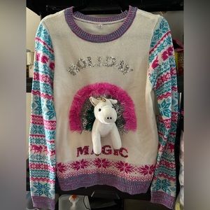 XL but fits more like a large. Holiday unicorn sweater